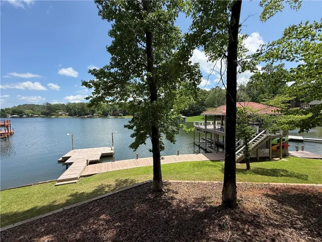 This serene waterfront property offers direct lake access and private boat facilities.