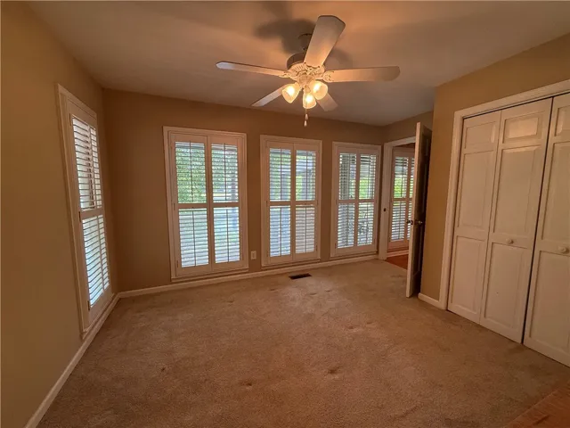 This inviting room features warm tones and ample natural light, ideal for relaxation.