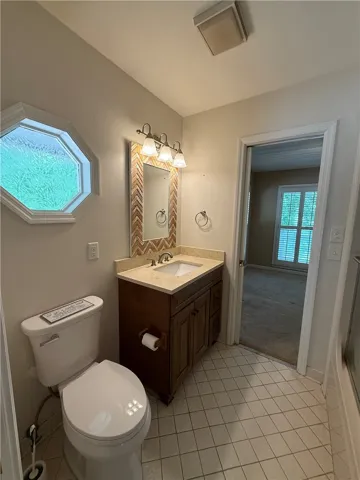 This bathroom features a contemporary vanity with a practical layout.