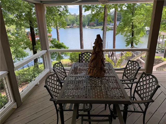 Enjoy tranquil lake views from this inviting covered patio.