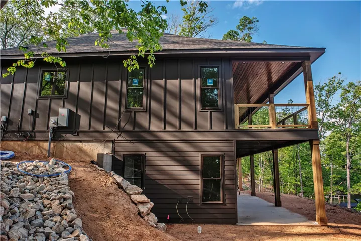 This modern home offers a spacious deck and ample outdoor living.