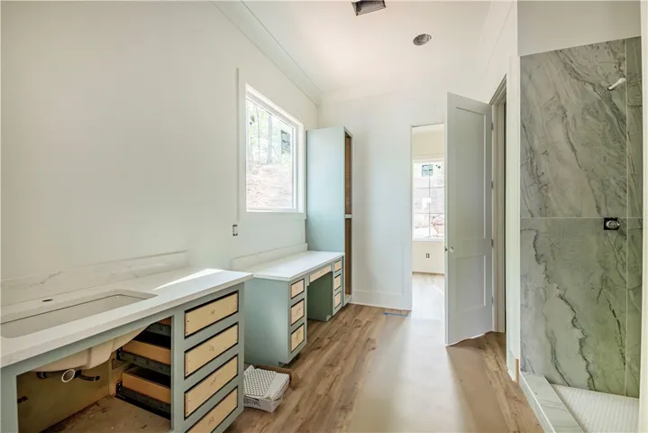 This primary bathroom is a blank canvas, awaiting your personal touch.