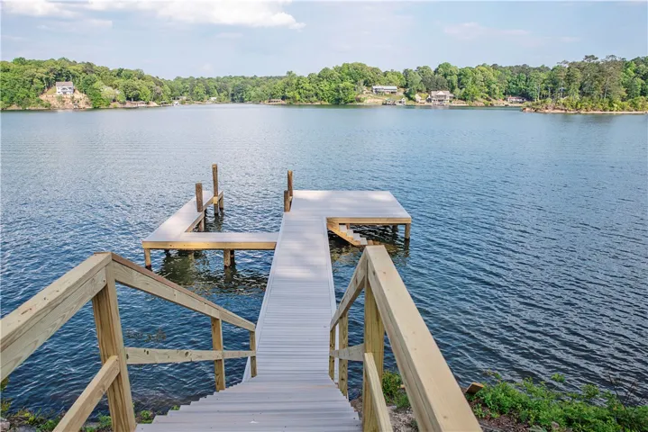 This serene waterfront property offers direct access to the lake with a private dock.