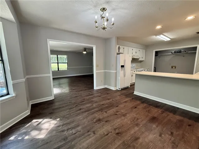This inviting space combines comfortable living with a well-appointed kitchen, perfect for everyday living.