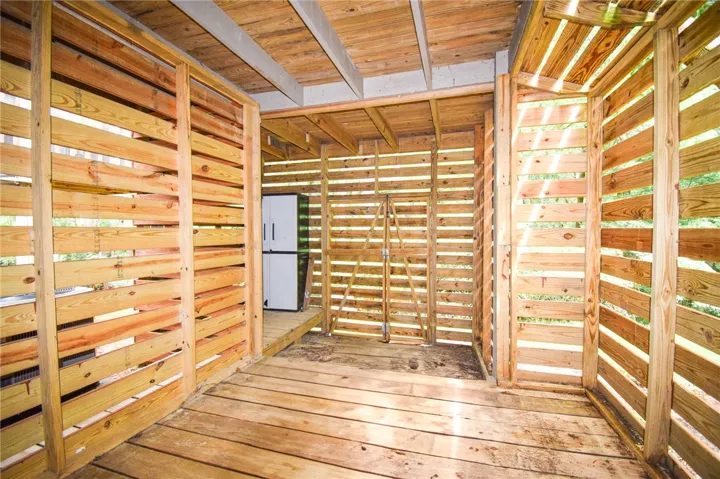 This outdoor storage space offers practical utility with a natural wood aesthetic.