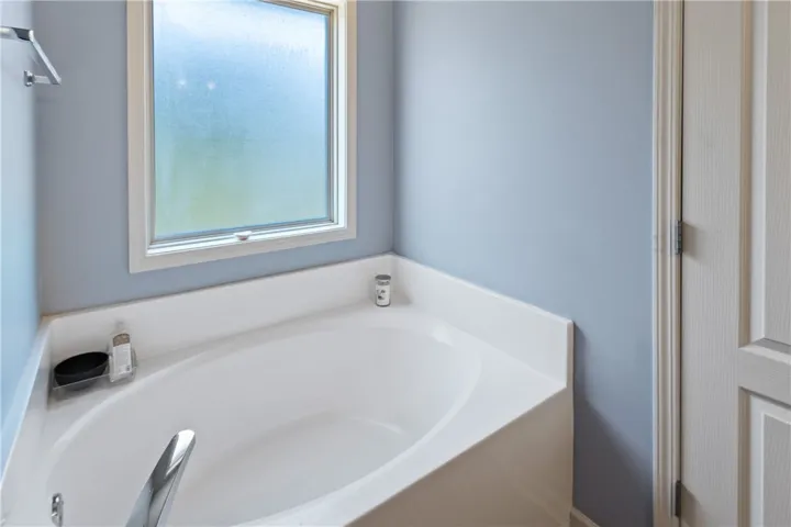 Relax in this inviting soaking tub, perfect for unwinding after a long day.
