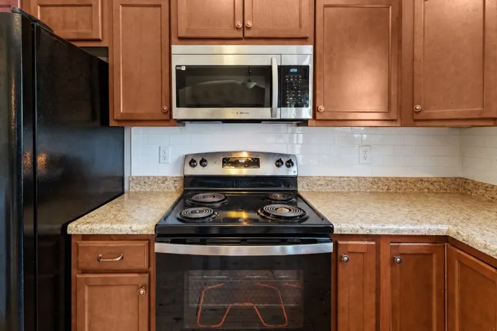 This efficient kitchen features functional appliances and ample countertop space.