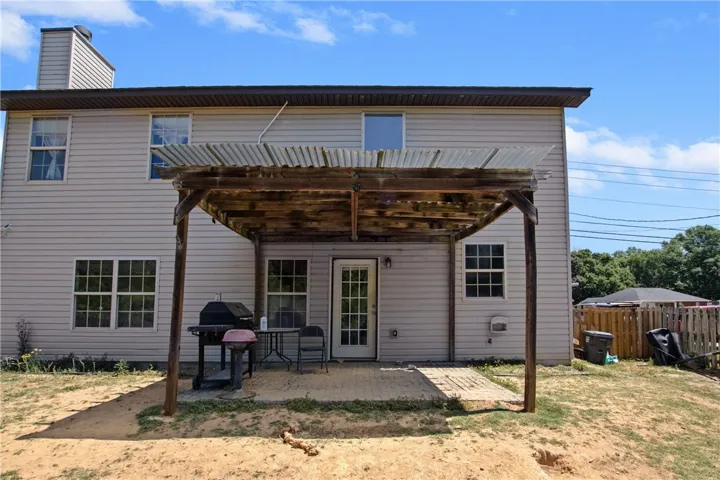 This two-story residence features a charming patio area, perfect for outdoor enjoyment.