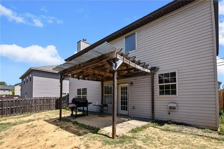 This outdoor space offers a comfortable patio, perfect for relaxing or entertaining.
