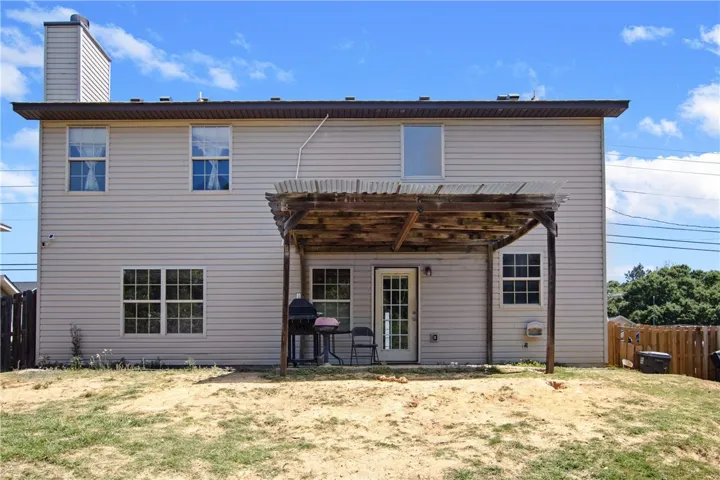 The outdoor living space of this residence provides ample room for relaxation and entertainment.