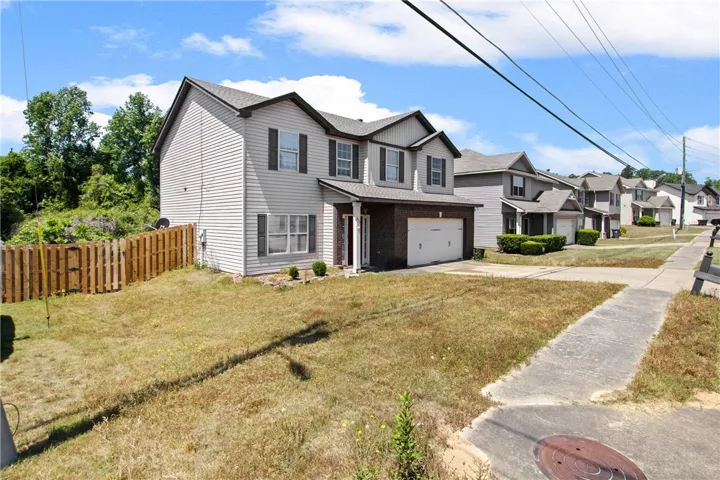 This charming home offers a spacious yard and inviting curb appeal.