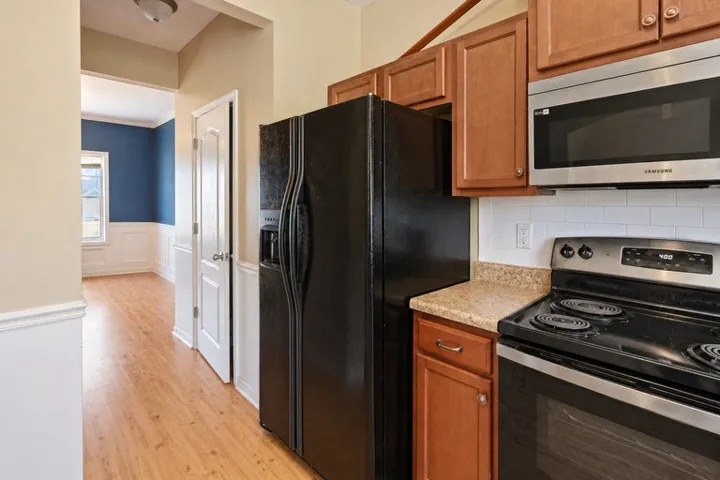 This functional kitchen features modern appliances and ample counter space for everyday living.