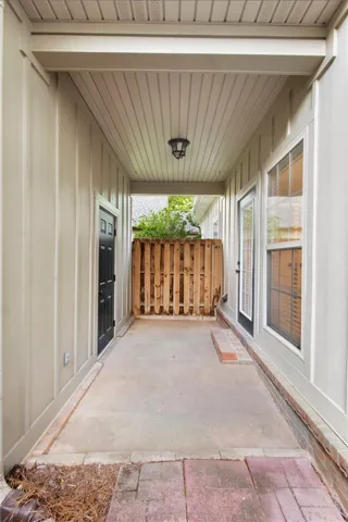 Covered porch between house and garage