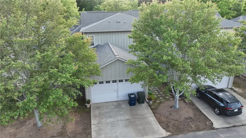 Garage is accessed off alley behind condo.