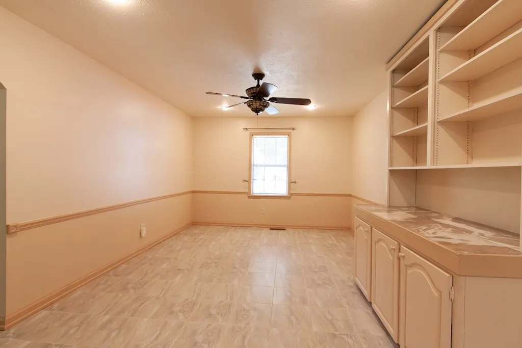 This Breakfast/Dining Room offers built-in storage and tiled flooring.