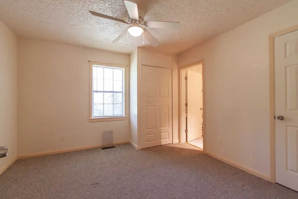 This cozy room offers ample light and convenient access, ready for your personal touch.