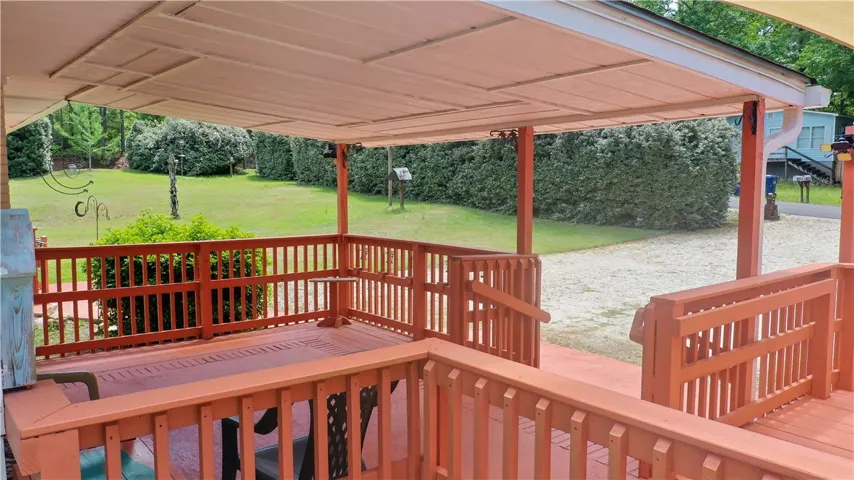 Enjoy the peaceful surroundings from this inviting outdoor deck.