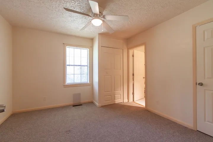 This cozy room offers ample light and convenient access, ready for your personal touch.
