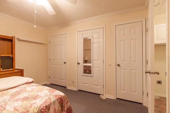 Mobile Home bedroom features ample closet space and carpeting with an en-suite bath.