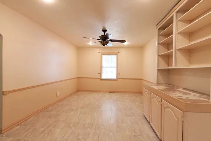 This Breakfast/Dining Room offers built-in storage and tiled flooring.