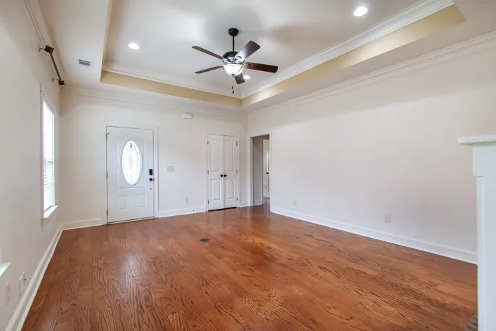 Bright and airy interior with gleaming hardwood floors awaits your personal touch.