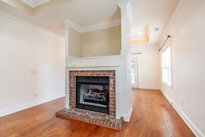The unique floating fireplace divides the living room from the dining.