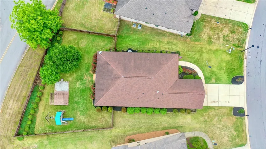 An aerial perspective showcases a large backyard.