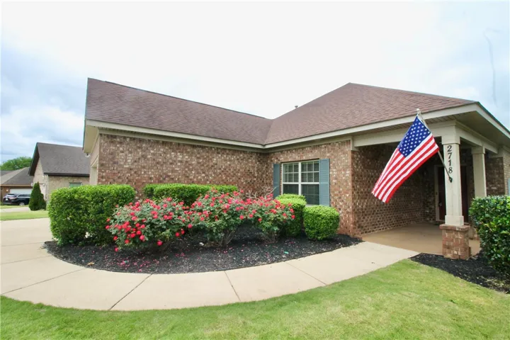 This charming home offers manicured landscaping and a welcoming front entry.