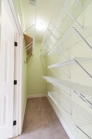 The walk-in closet is well organized.