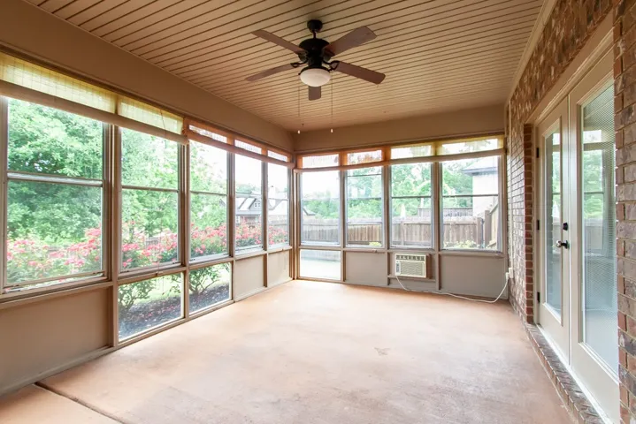 Enjoy the outdoors year-round in this expansive, light-filled sun room.