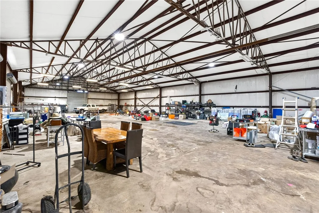 Expansive interior space with high ceilings offers versatile functionality for various needs.