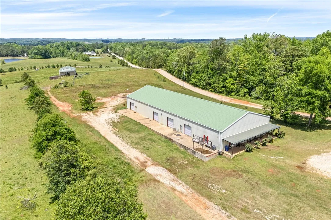 This expansive rural property features a large warehouse, providing ample space for various operations.