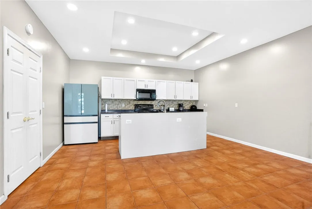 Bright and inviting kitchen with an island, perfect for daily living and entertaining.