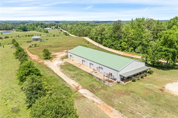 This expansive rural property features a large warehouse, providing ample space for various operations.