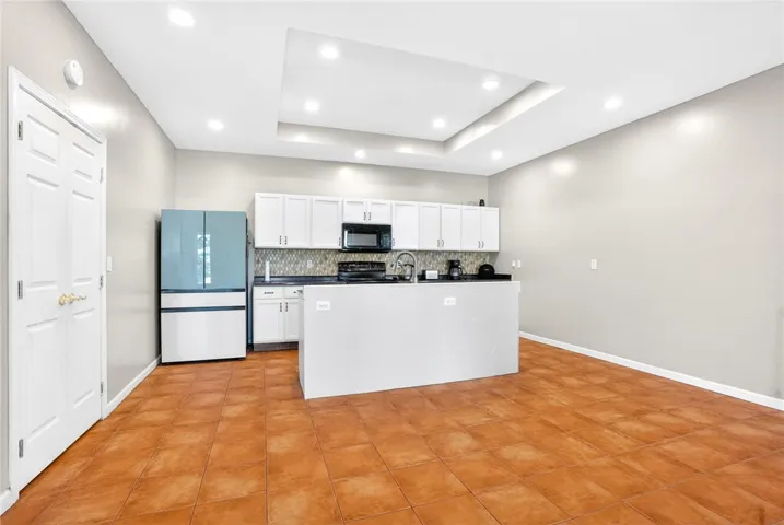 Bright and inviting kitchen with an island, perfect for daily living and entertaining.
