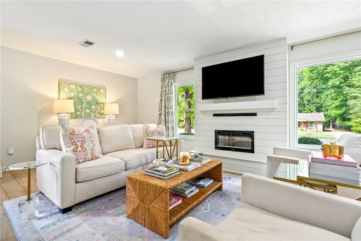 This bright living room offers a comforting ambiance, perfect for gatherings and daily relaxation.