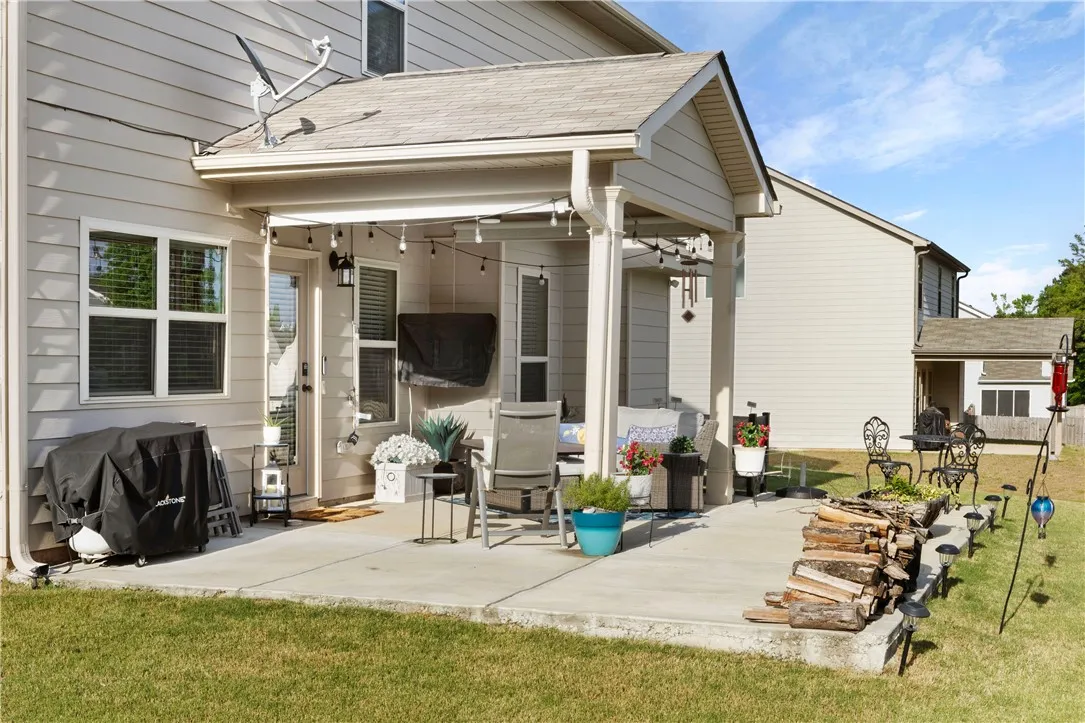 This inviting patio extends living space, perfect for outdoor leisure and entertaining.
