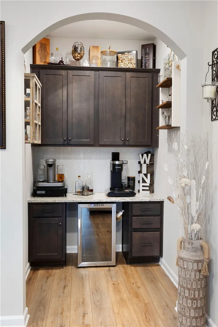 This dedicated beverage station with built-in cabinetry provides effortless entertaining and daily convenience.