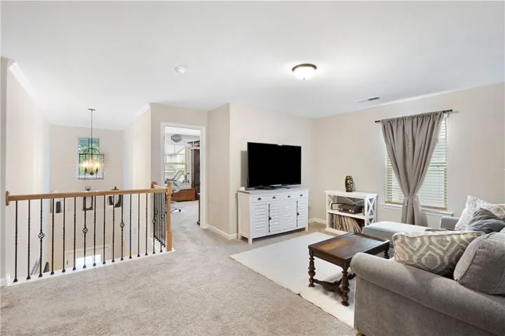 This inviting loft features a seamless flow, ideal for both relaxation and everyday living.