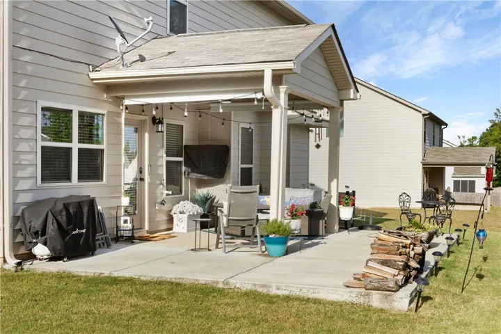 This inviting patio extends living space, perfect for outdoor leisure and entertaining.