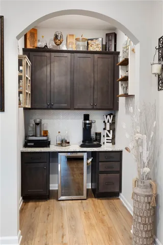 This dedicated beverage station with built-in cabinetry provides effortless entertaining and daily convenience.