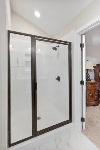 This modern shower with tile flooring provides a refreshing and elegant bathroom experience.