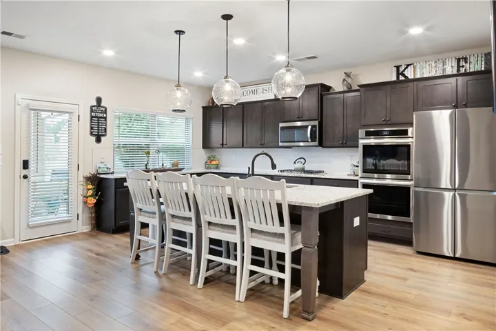 This spacious kitchen offers a blend of style and functionality, perfect for everyday living.