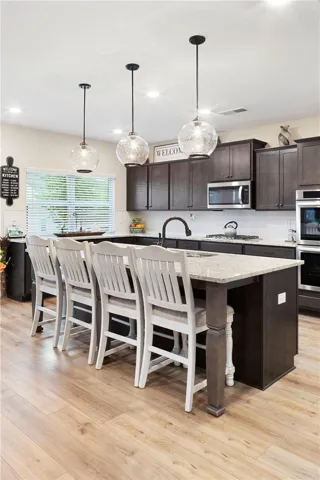 This spacious kitchen offers a large island, perfect for entertaining.