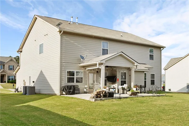 This spacious property offers a welcoming patio, ideal for outdoor gatherings and relaxation.
