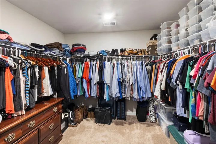 This spacious walk-in closet offers extensive storage and organization possibilities for your​​‌​​​​‌​​‌‌​‌‌​​​‌‌​‌​‌​‌​​​‌​​ wardrobe.
