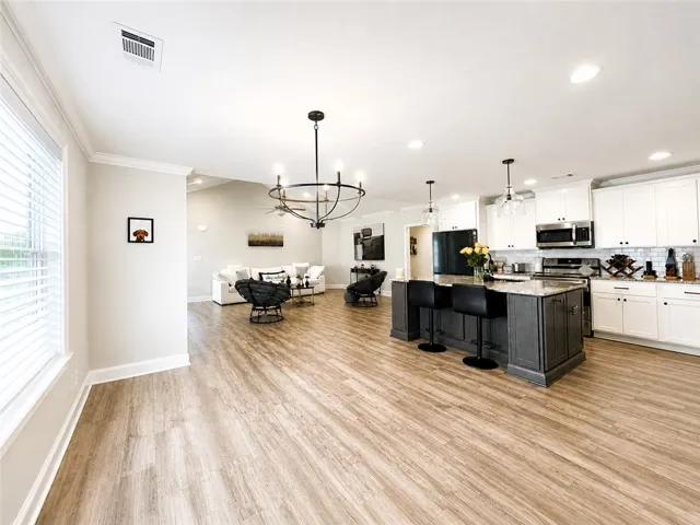 This inviting space offers an open layout, ideal for daily living and entertaining.