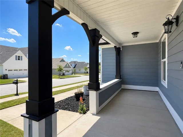 Welcome to this inviting home featuring a charming front porch, perfect for relaxation.