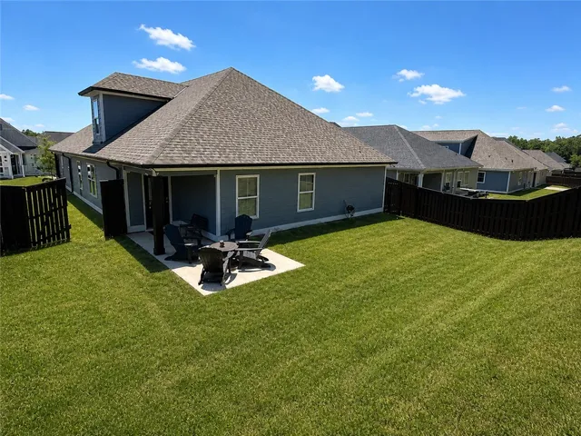 Enjoy outdoor living with a spacious yard and inviting patio.