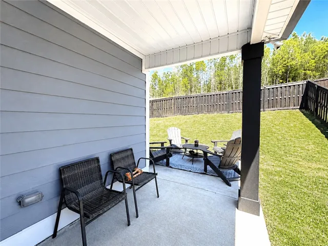 This inviting patio offers a private outdoor retreat with ample space for relaxation.